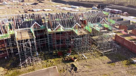 Abandoned-property-development-framework-left-on-builders-construction-site,-aerial-view