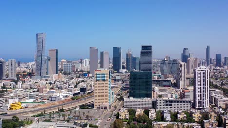 panoramic view of a modern city skyline with skyscrapers and a highway