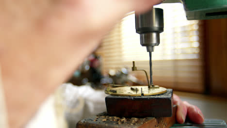 Horologist-using-drill-machine