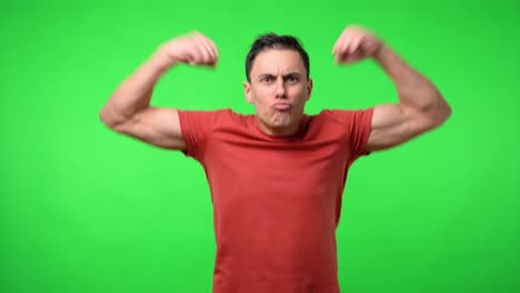 nice man putting funny strongman poses. with a red shirt. medium shot.