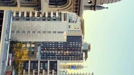 Vertical-truck-right-view-of-the-dome-of-Los-Sacramentinos-Church-with-the-Entel-Tower-isolated-among-residential-buildings,-Santiago-Chile