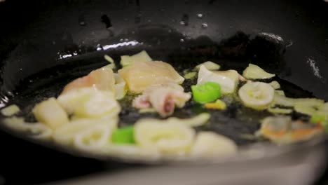 stir-fried vegetables sizzle in a wok, captured in a vibrant, blurry close-up
