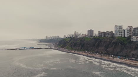 aerial view of coastal city with cliffs and ocean
