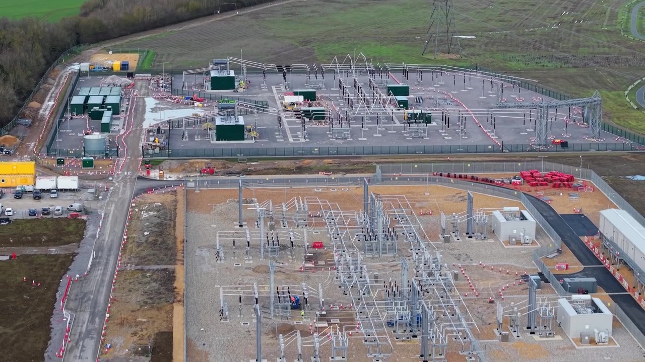 Aerial view of a major high-voltage electrical substation in Biggleswade, UK.