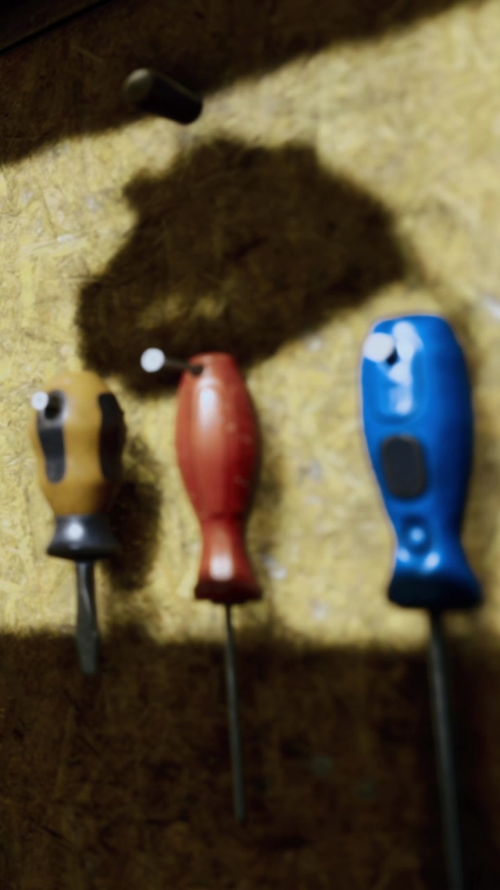 People use tools in a workshop for home repair activities in the evening