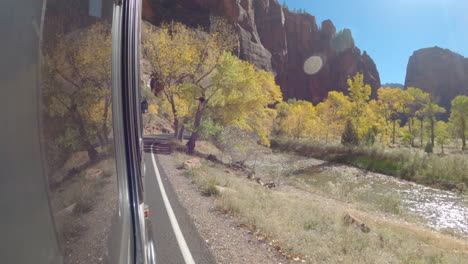 shot of zion national park from the side of a public bus