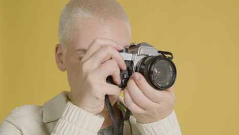 Woman-takes-photograph-on-vintage-camera-04