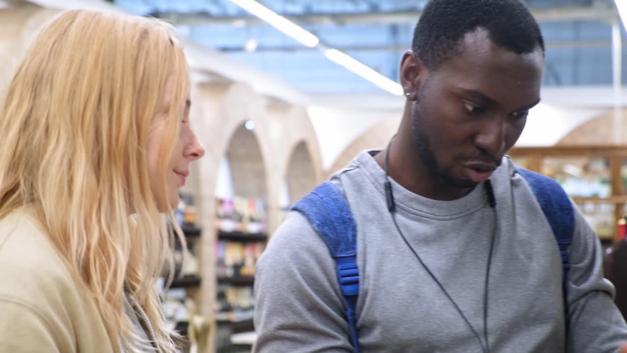 Couple Choosing Wine in a Grocery Store