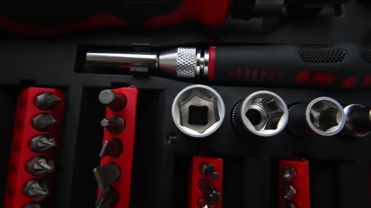 Close up shot of a professional tool kit with screwdriver bits and sockets neatly organized