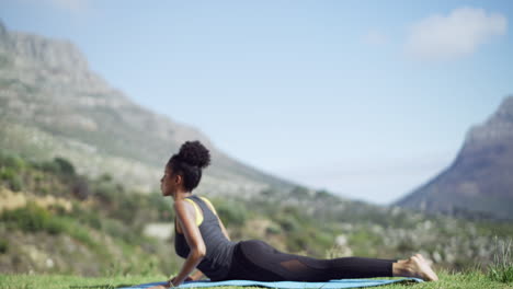 woman practicing yoga outdoors