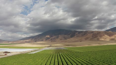 farm land with clouds aerial view