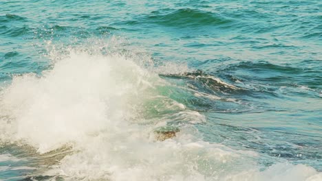 breakwater and splashes of wave in sea shore. slow motion