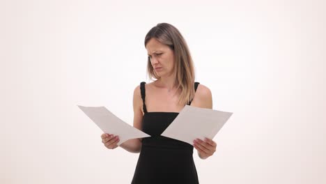 A concerned woman reading documents