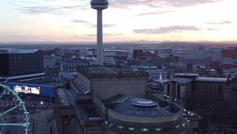 liverpool city christmas market sunset skyline and radio city landmark aerial view tilt down to ferris wheel