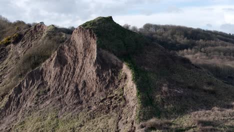 aerial-footage-of-coastal-errosion,-North-Yorkshire-coastline,-Cayton-Bay