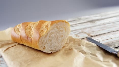 single baguette with knife