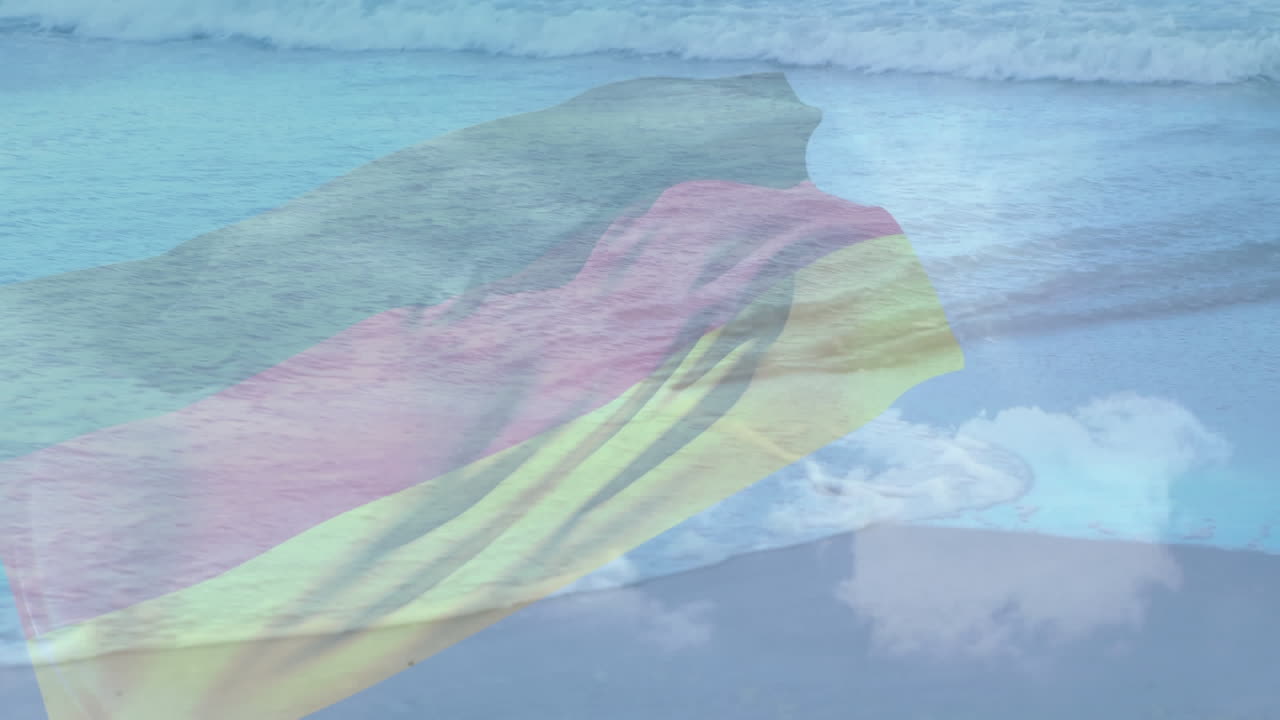 composición digital de ondear la bandera de alemania contra la vista de la playa y las olas del mar