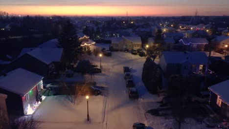 residential area in the city of saint constant at night covered in snow illuminated with lights, quebec , canada
