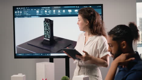 vertical video female real estate contractor presenting structural blueprints and 3d models