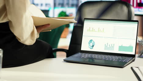 Ambitious woman CEO working in her modern corporate office
