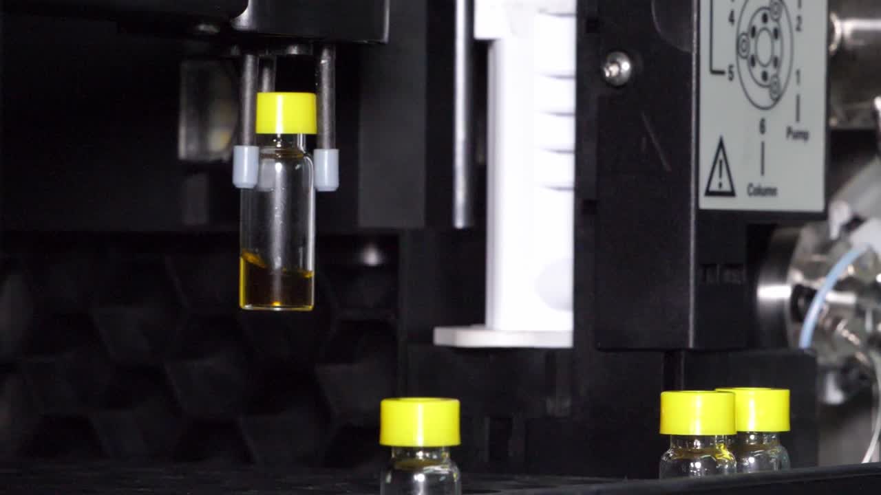 Medicine research in medical laboratory, process of vaccine development, automatically machine do an experiment on sample in science lab