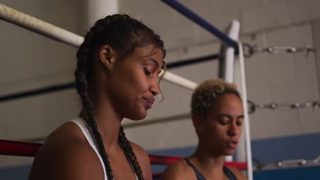 two mixed women wrapping their hands