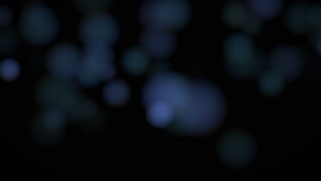 caída de brillos azules y partículas sobre la moda y el fondo brillante