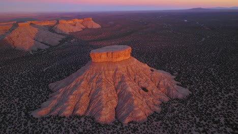 stunning desert landscape with unique rock formations at sunrise or sunset