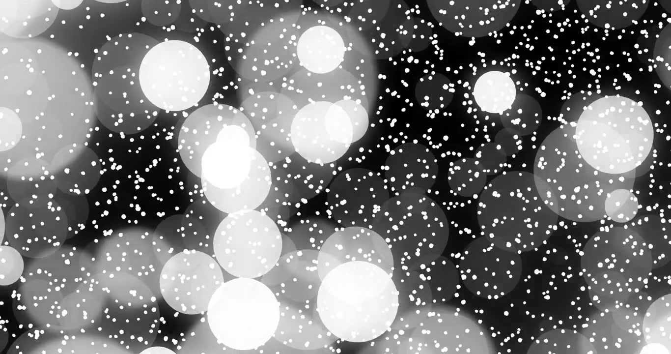 Il primo fotogramma mostra dense sfere bokeh di puntini bianchi che si spostano, fluttuando su uno sfondo nero, evocando calma.