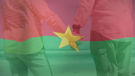 holding hands, two people with burkina faso flag animation overlay