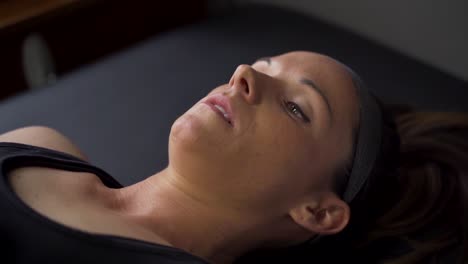 athlete laying on physio table for examination