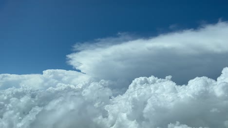 dense accumulated cumulus clouds against blue sky