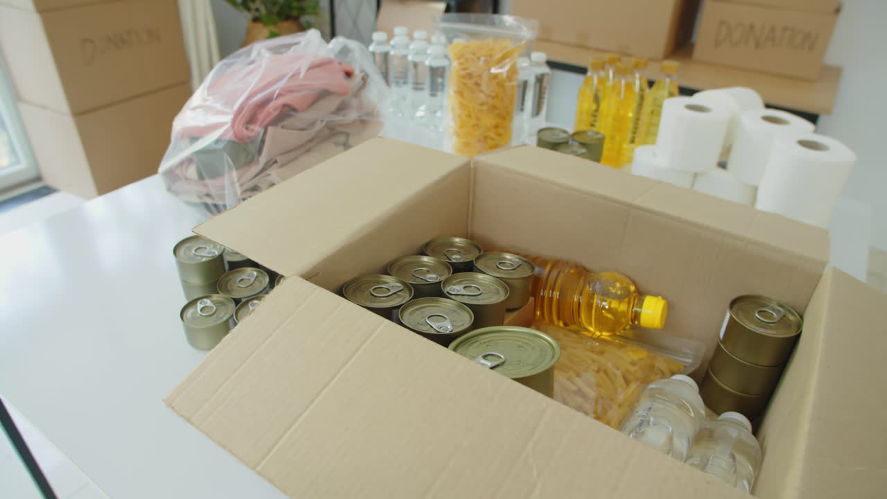 Canned Goods, Cooking Oil and Other Food in Box for Donation