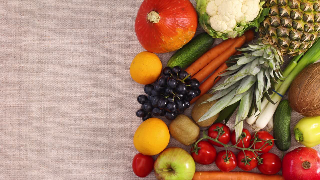 Frame for text and recipe next to fresh fruits and vegetables. Stop motion