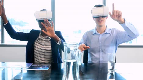 male and female executives using virtual reality headset 4k