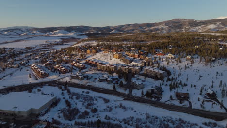 aerial orbiting shot of homes in the rocky mountains