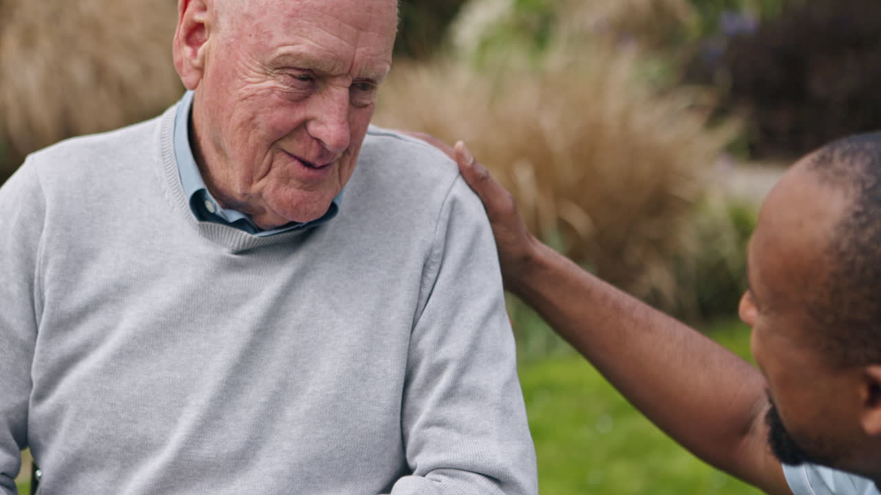 Caregiver Supporting Elderly Man