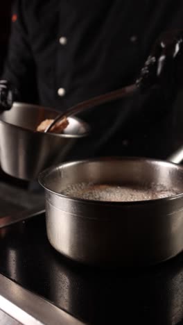 chef cooking meat in a pot