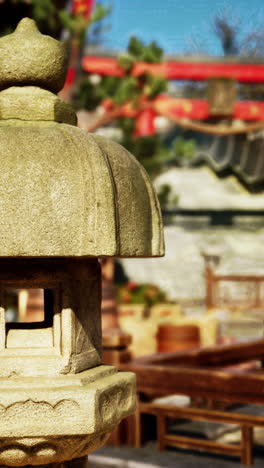 a stone lantern in a japanese garden