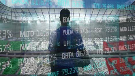 stock market data processing over rear view of male rugby player against sports stadium