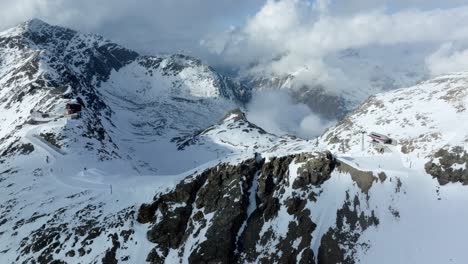 drone footage of the chairlift and gondola at diavolezza glacier in switzerland during winter times