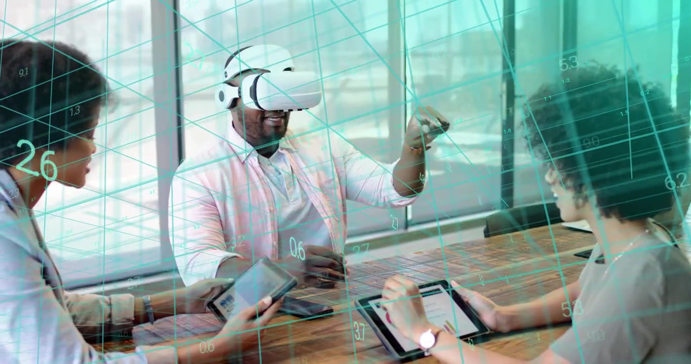 Man wearing VR headset and gesturing manipulating dashboard in tech demo while team tapping devices
