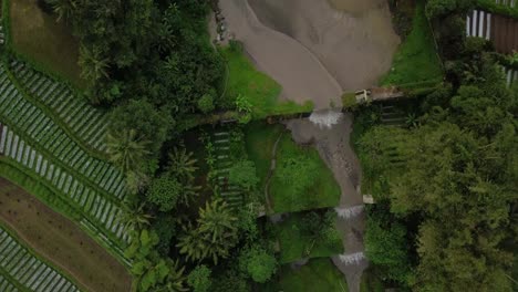 sandy-river-with-waterfall-and-vegetable-plantation-on-the-side