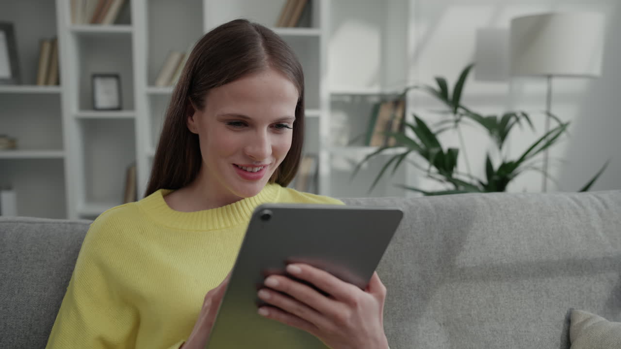 Woman reading on a tablet