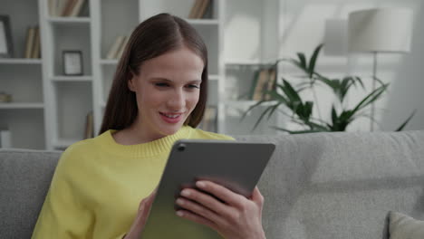 woman reading on a tablet