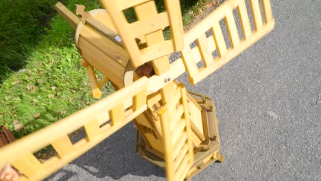 a small wooden windmill toy with the propeller turning around