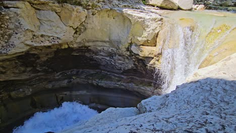 waterfall cascading into a rocky gorge