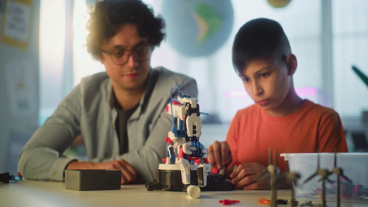 Students learning robotics with a teacher