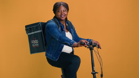 courier using bicycle to deliver package