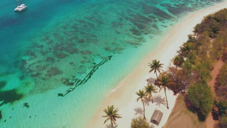 Amazing-beach-destination-on-Petit-St-Vincent-with-a-yacht-in-the-background